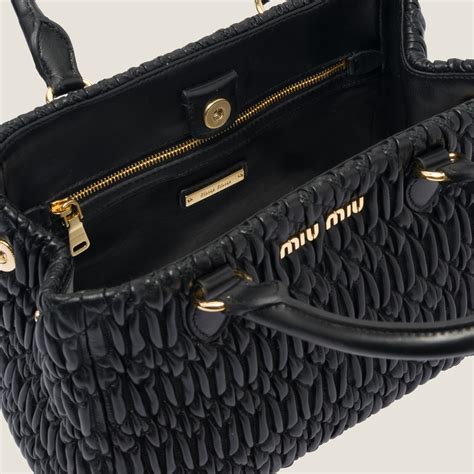 Miu Crystal cloqué nappa leather handbag.